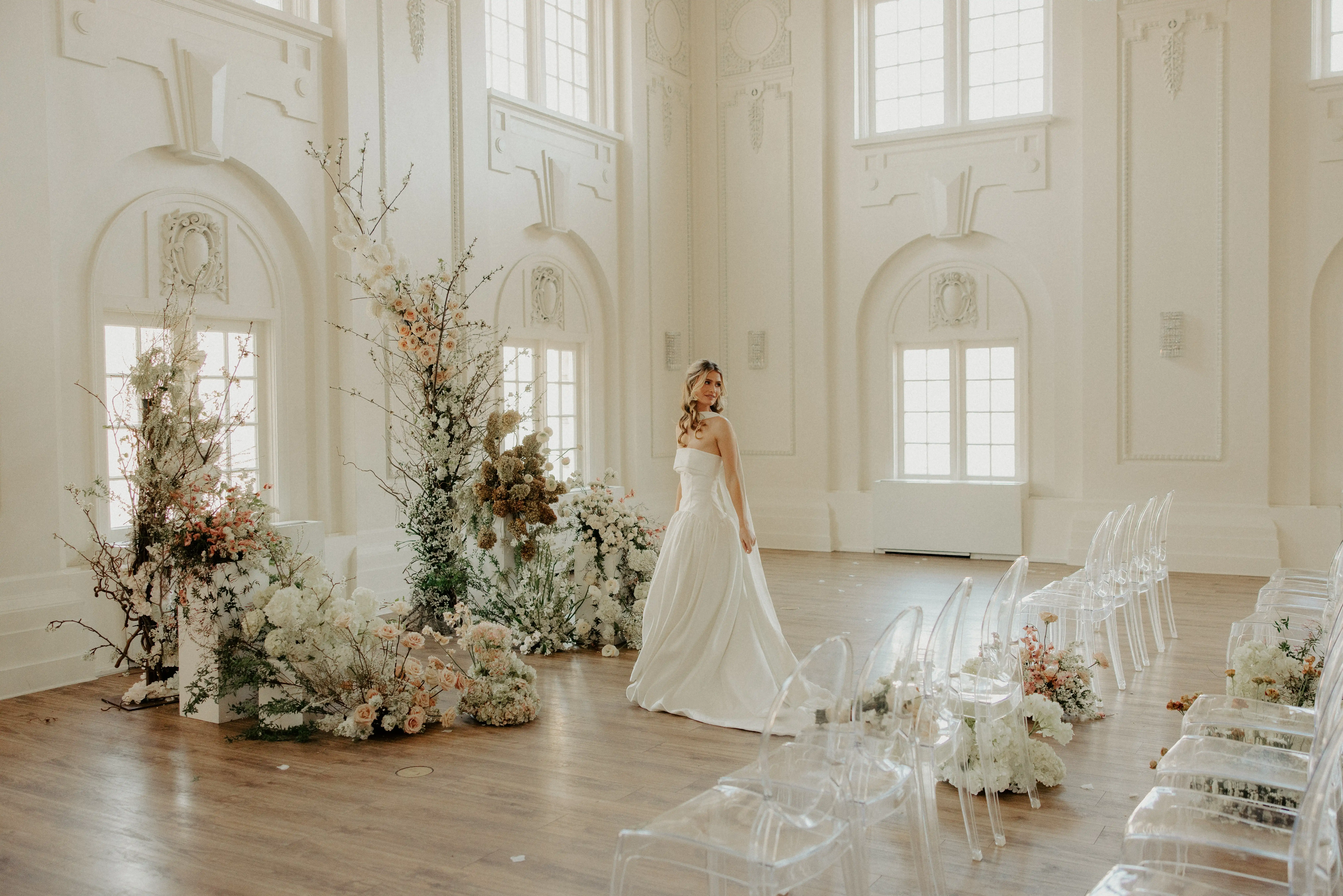 Bride walking through the ballroom at The Commercial Club