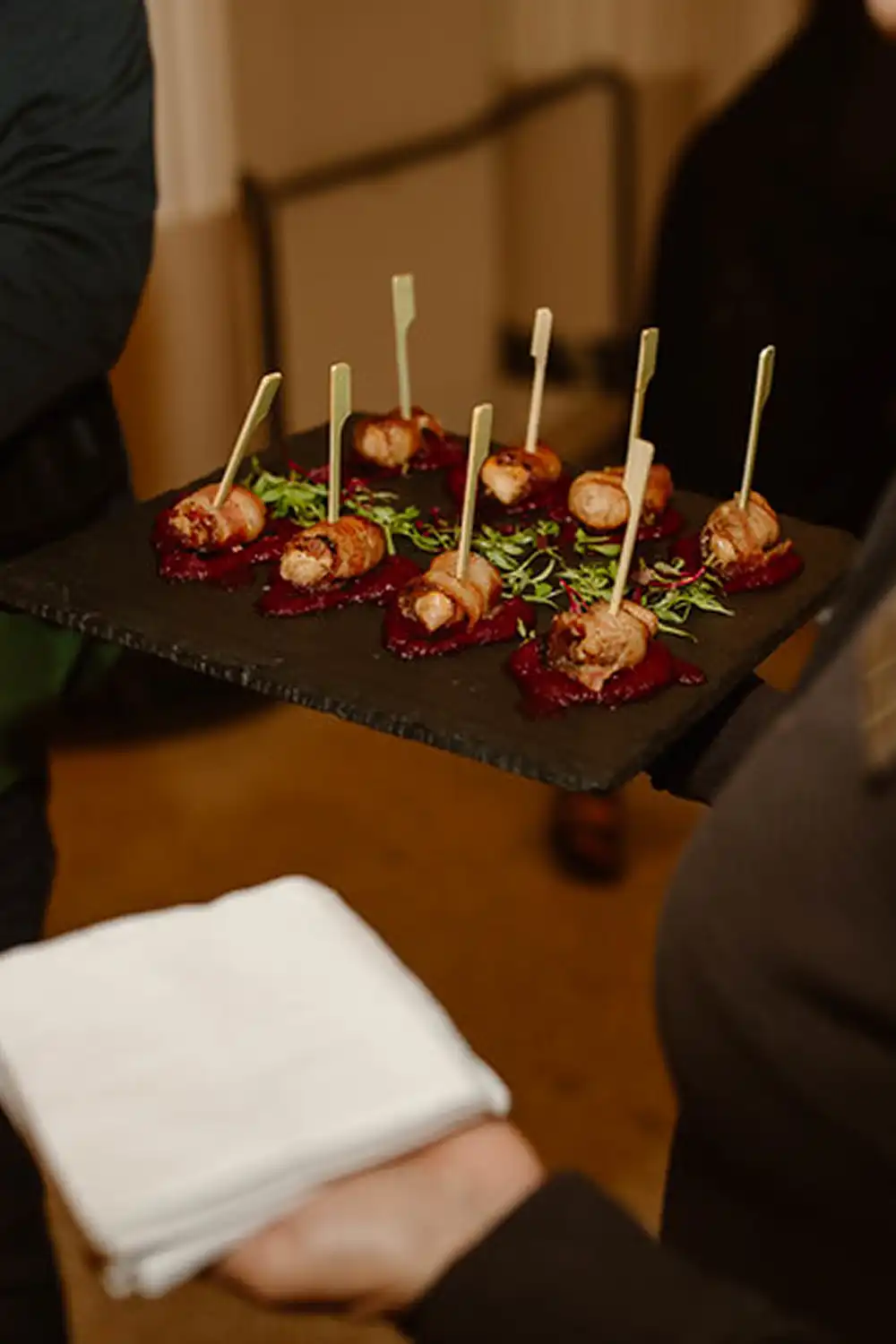 A softly lit tablescape inside the ballroom