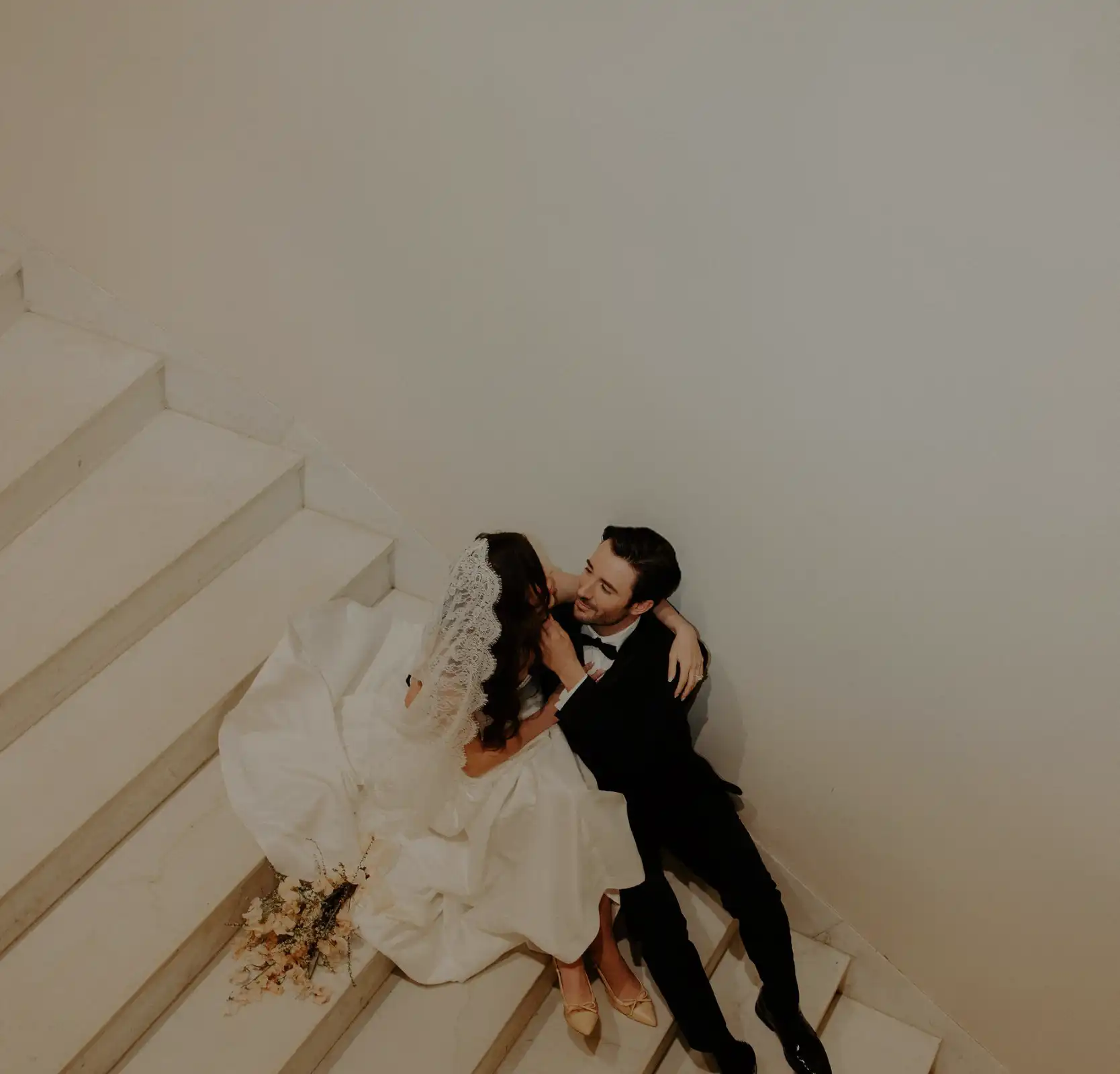 Sunlit ballroom interior with ornate columns and chandeliers